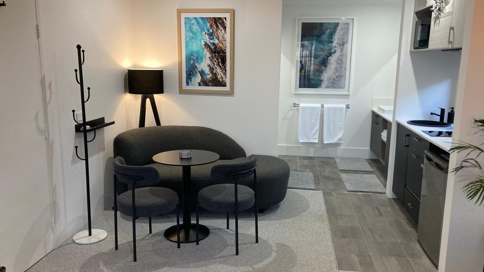 BRiX living area with curved sofa and adjoining kitchenette